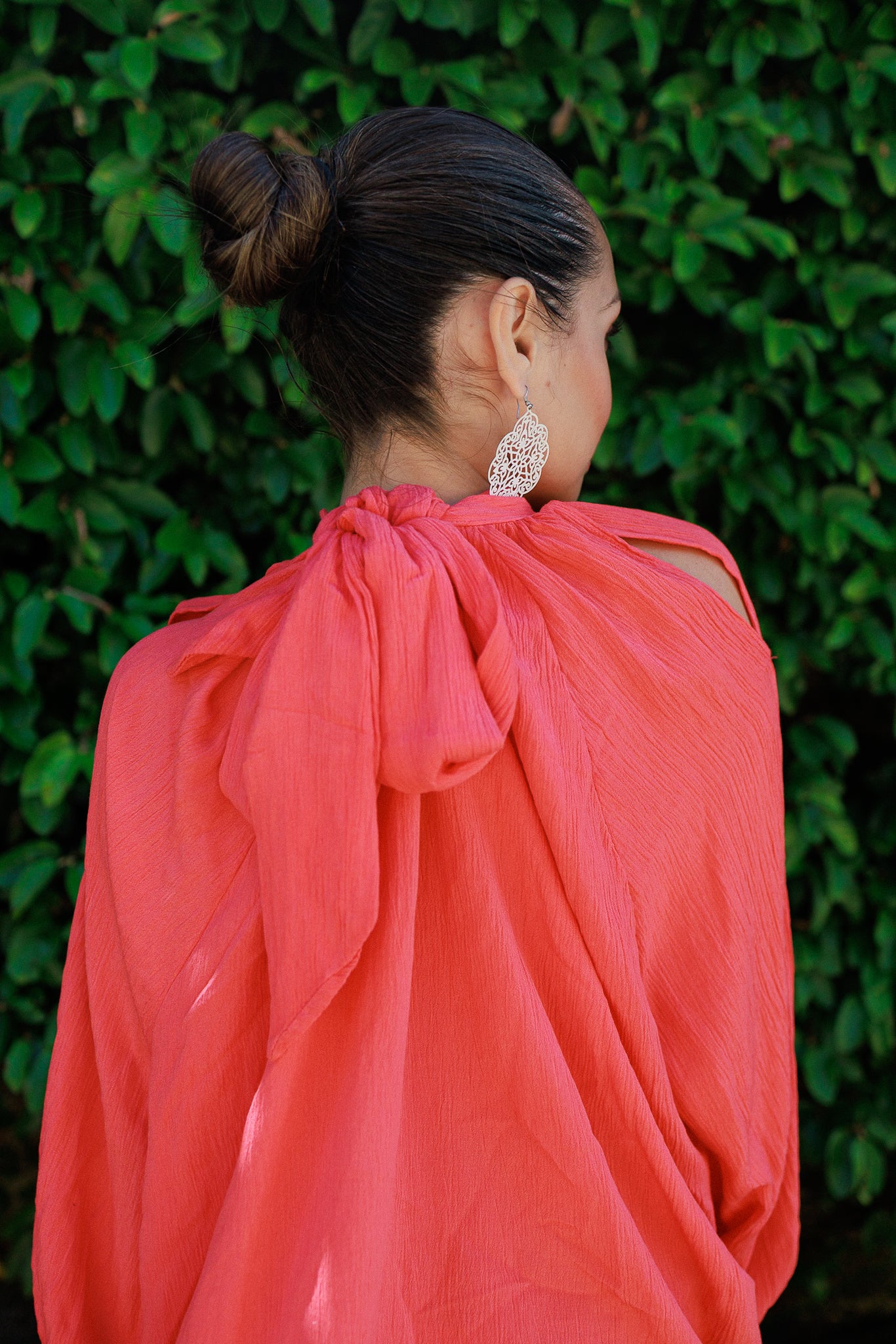 Blusa corallo con maniche aperte