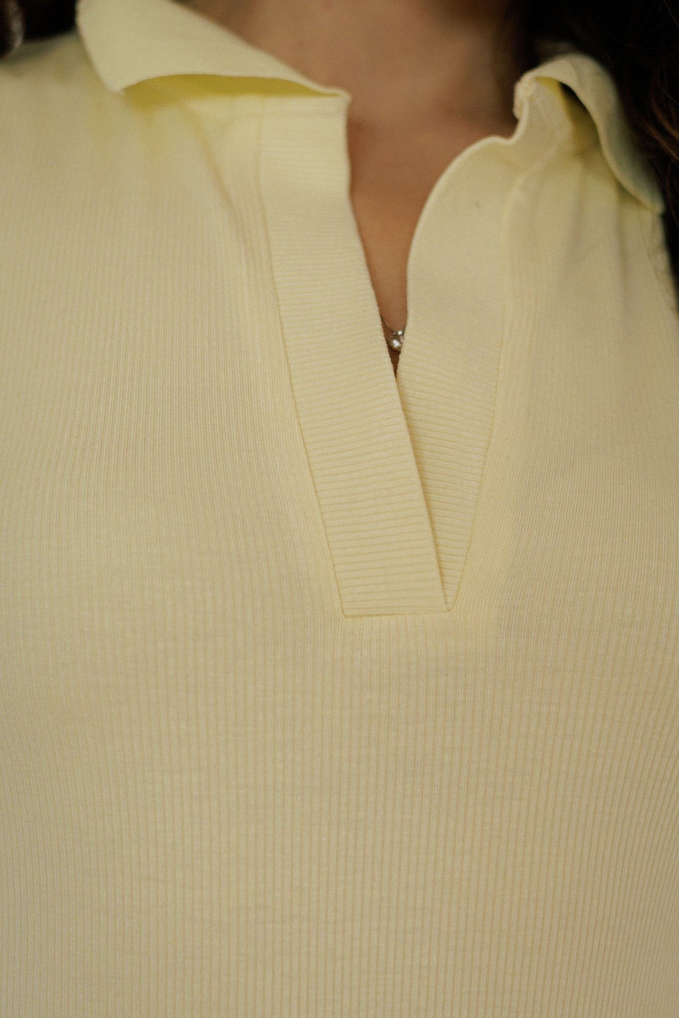 Body smanicato polo giallo