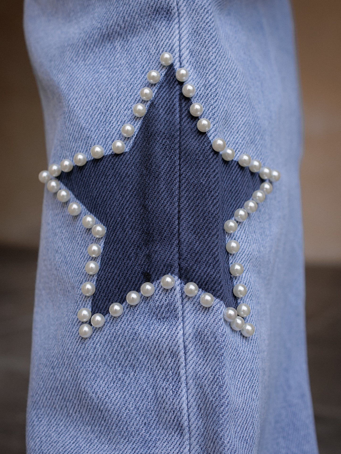 Jeans con dettaglio stella